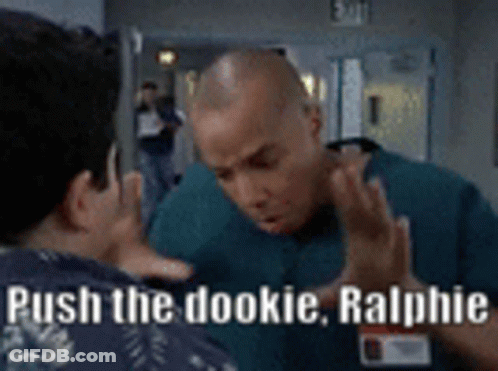 Two Men Talking In Hallway Saying Push The Dookie Ralphie GIF