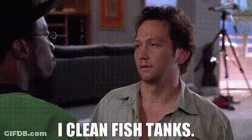 Two Men Talking In Living Room Saying I Clean Fish Tanks GIF