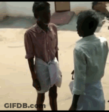 Two Men Talking In Sand GIF