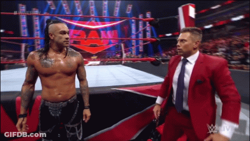 Two Men Talking In Wrestling Ring GIF