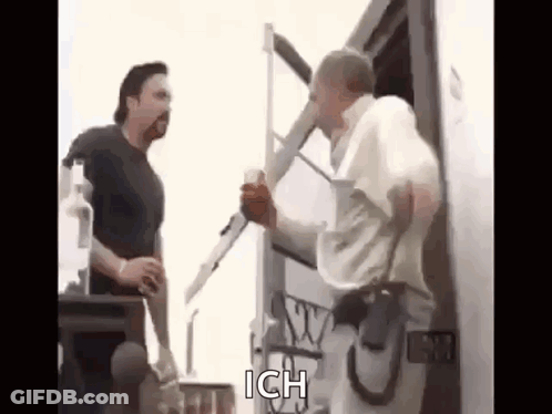 Two Men Talking Next To Truck GIF