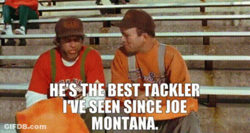 Two Men Talking On Bleachers, Red Shirt GIF
