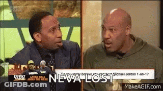 Two Men Talking On TV Show With Neva Lost Behind Them GIF