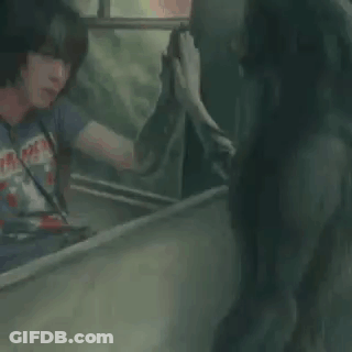 Two Men Talking One Wearing Iron Maiden Shirt GIF