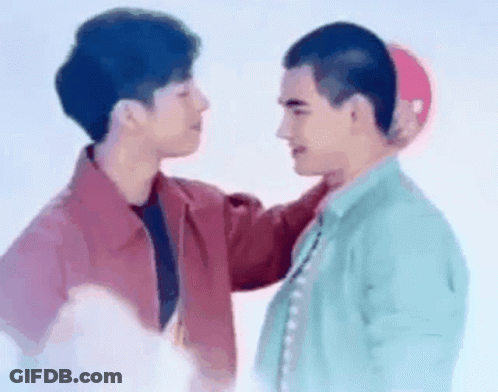 Two Men Touching Heads GIF
