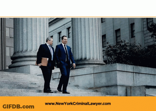 Two Men Walking Down Stairs With The Website Www.newyorkcriminallawyer.com In The Background GIF