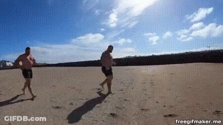 Two Men Walking On Beach Freegifmaker GIF