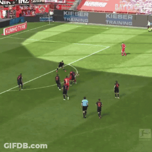 Two Men Walking On Field One Wearing AXA Shirt GIF