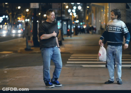 Two Men Walking One In Snowflake Sweater GIF