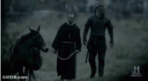 Two Men Walking With Horse And History Sign GIF