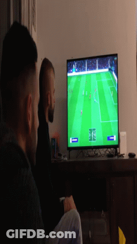 Two Men Watching Soccer On Flat Screen TV GIF