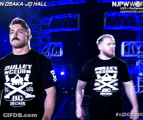 Two Men Wearing Bullet Club Bc Decade T-Shirts GIF