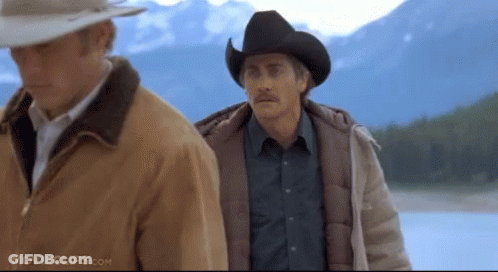 Two Men Wearing Cowboy Hats Are Standing Next To Each Other With Movieclips.com Written On The Bottom Of The Screen GIF
