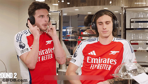 Two Men Wearing Emirates Jerseys GIF
