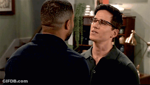 Two Men Wearing Glasses Talking GIF