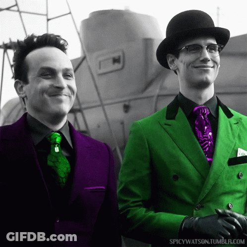 Two Men Wearing Green Suits And Purple Ties Are Standing Next To Each Other With Spicywatson.tumblr.com In The Corner GIF