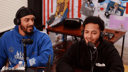 Two Men Wearing Headphones And A Hoodie That Says Atlanta On It GIF