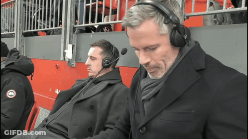 Two Men Wearing Headphones And A Jacket That Says Goose On It GIF