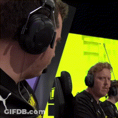 Two Men Wearing Headphones Are Sitting In Front Of A Yellow Screen . GIF