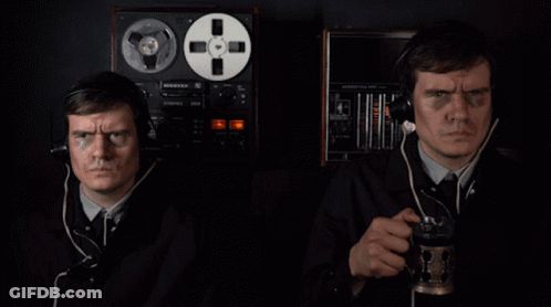 Two Men Wearing Headphones Are Standing In Front Of A Record Player That Says ' Pioneer ' On The Front GIF