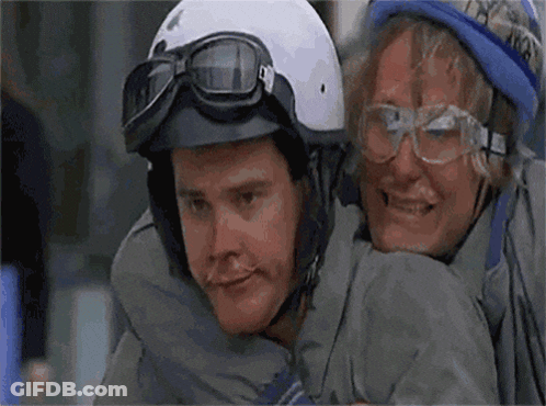 Two Men Wearing Helmets And Goggles Are Posing For A Photo GIF