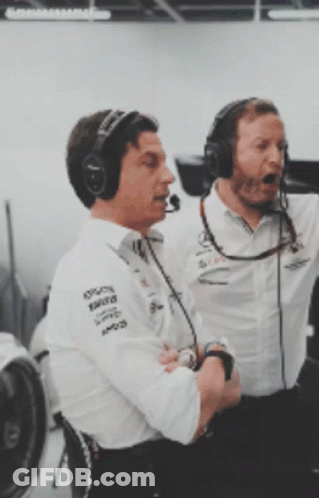 Two Men Wearing Mercedes Shirts And Headphones GIF