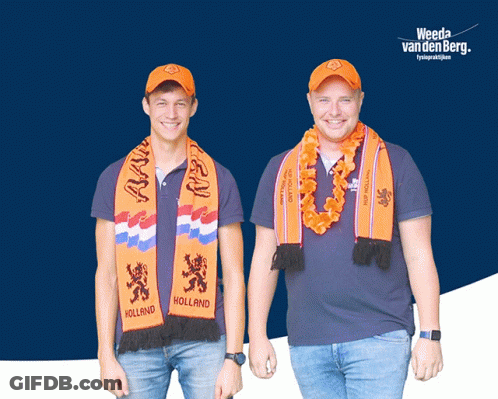 Two Men Wearing Orange Scarves That Say Holland Are Standing Next To Each Other GIF