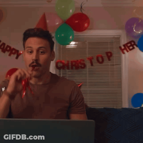 Two Men Wearing Party Hats Are Smiling In Front Of A Sign That Says " Happy " GIF
