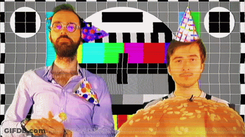 Two Men Wearing Party Hats Are Standing In Front Of A Checkered Screen GIF