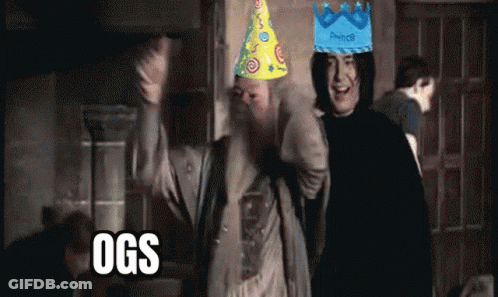 Two Men Wearing Party Hats With Ogs Written On The Bottom Right GIF