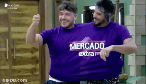 Two Men Wearing Purple Shirts That Say Mercado Extra Are Hugging Each Other GIF