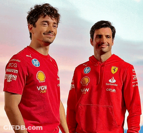 Two Men Wearing Red VGW Shirts GIF