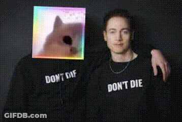 Two Men Wearing Shirts That Say Don't Die Posing GIF