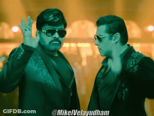 Two Men Wearing Sunglasses Are Standing Next To Each Other And The Caption Says @Mikelvelayudham GIF