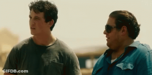 Two Men Wearing Sunglasses Are Standing Next To Each Other . GIF