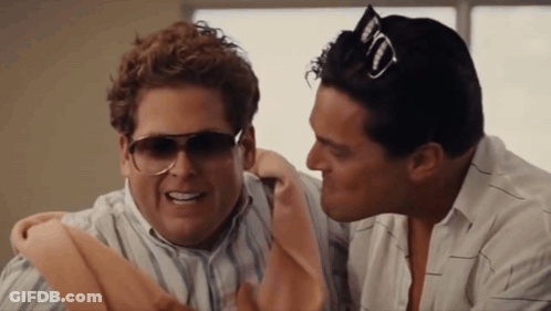 Two Men Wearing Sunglasses Are Talking To Each Other And One Has A Jack Daniels Hat On His Head GIF