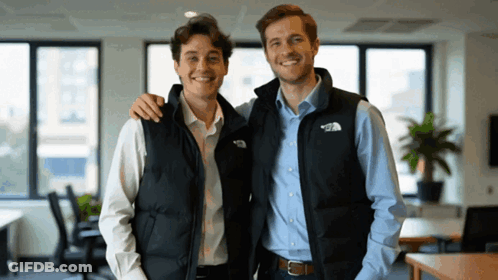 Two Men Wearing Vests That Say The North Face Are Posing For A Picture GIF