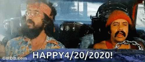 Two Men With Beards And Mustaches Are Sitting In A Car With A Drum In The Background . GIF