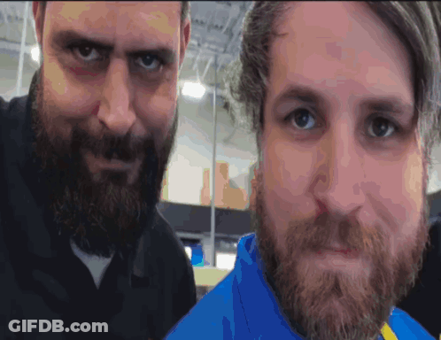 Two Men With Beards Are Posing For A Photo GIF