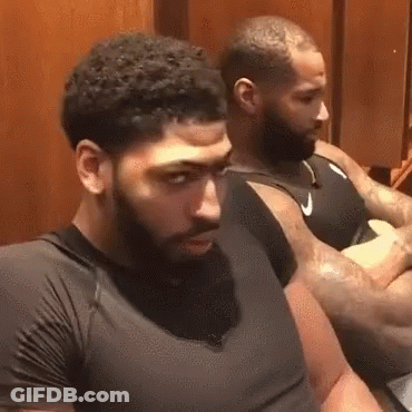 Two Men With Beards Are Sitting In A Locker Room . GIF