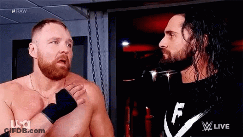 Two Men With Beards Are Standing Next To Each Other In A Room . GIF