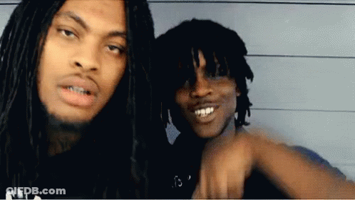 Two Men With Dreadlocks Are Posing For A Photo GIF