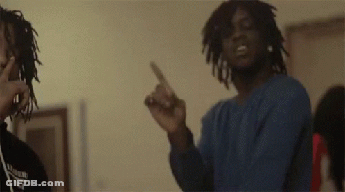 Two Men With Dreadlocks Are Standing Next To Each Other In A Room And Pointing At The Camera . GIF