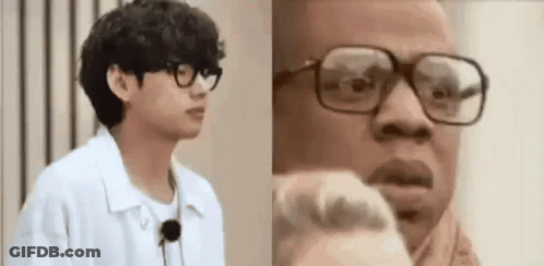 Two Men With Glasses, One In Scarf GIF