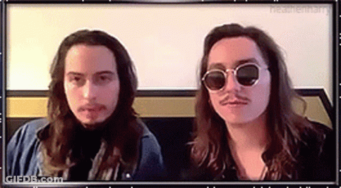 Two Men With Long Hair And Mustaches In Sunglasses GIF
