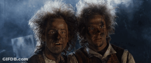 Two Men With Mud-Covered Faces GIF