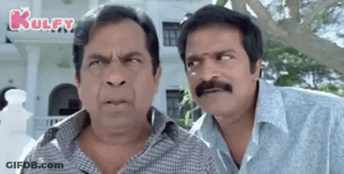 Two Men With Mustaches Making Funny Faces GIF