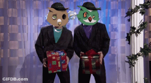 Two Men With Owl Masks Holding Presents GIF