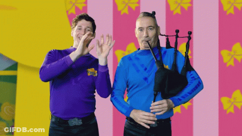 Two Men With Purple Shirt Saying Wiggle GIF