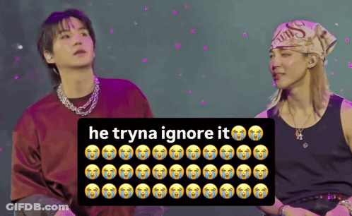 Two Men With Sign Saying He Tryna Ignore It GIF
